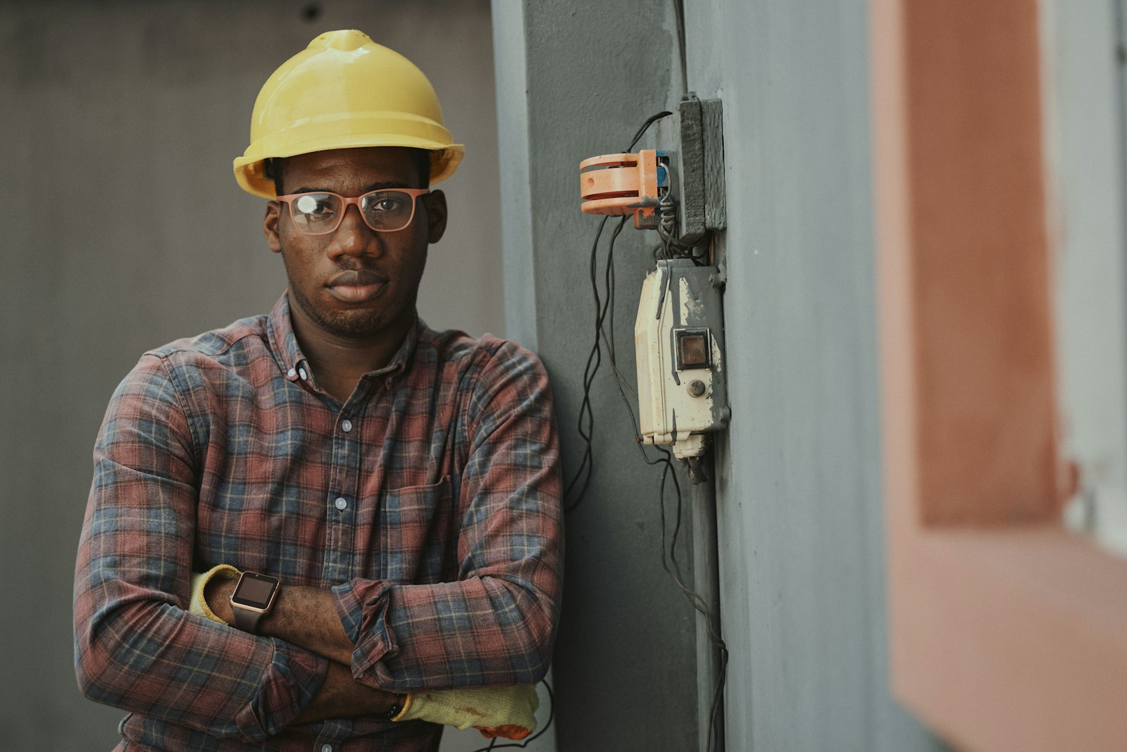 Site professional in hard hat and safety glasses
