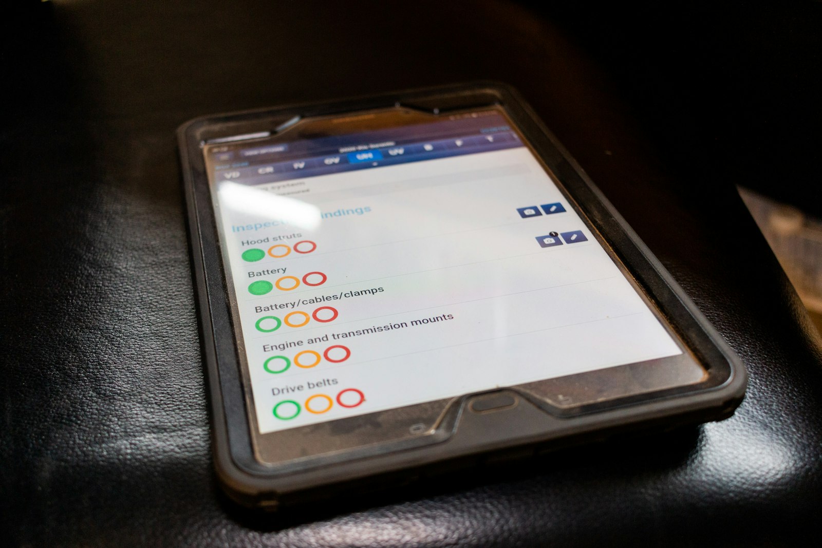 Worker reviewing an inspection checklist on a rugged tablet