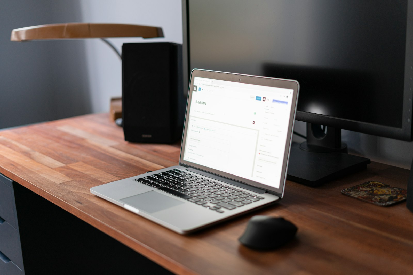 Laptop and monitor on an office desk